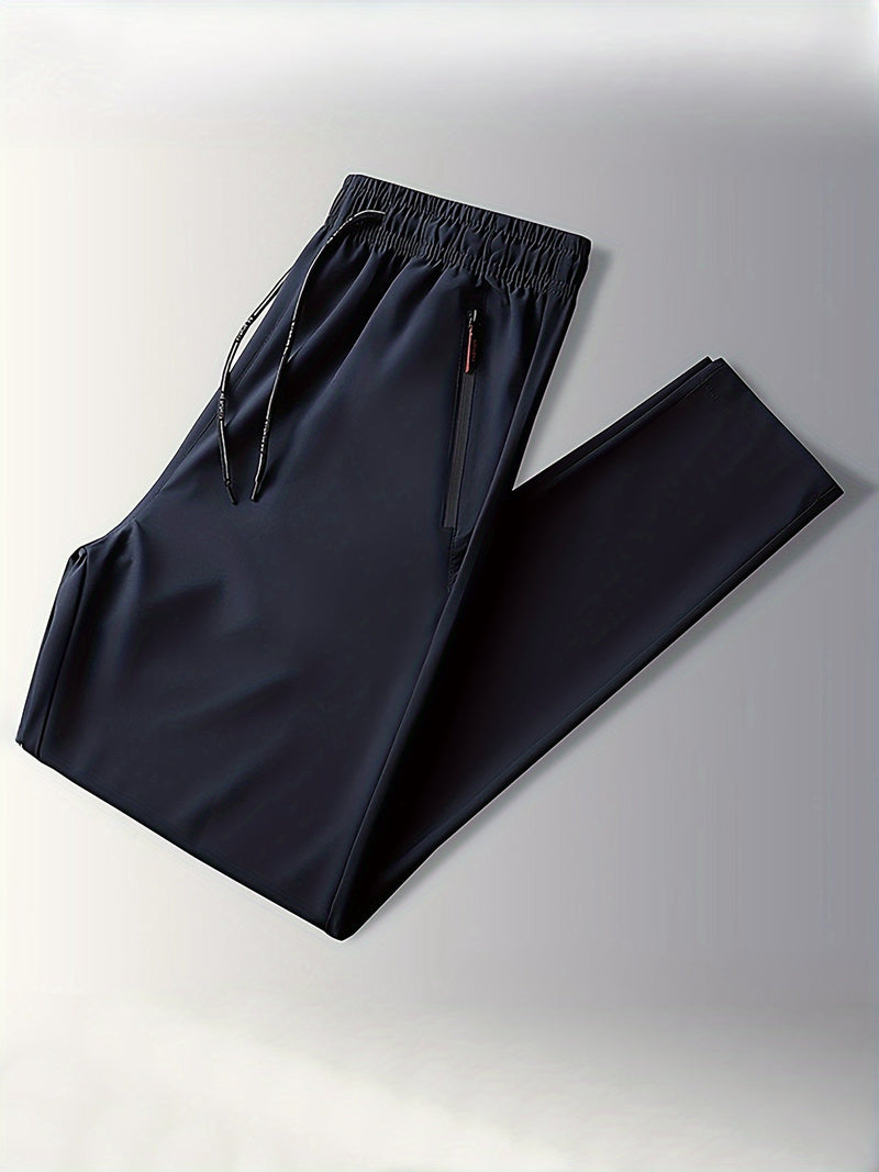 Schwarze Herren-Sporthose, elastischer Bund, Reißverschlusstaschen, atmungsaktives Material