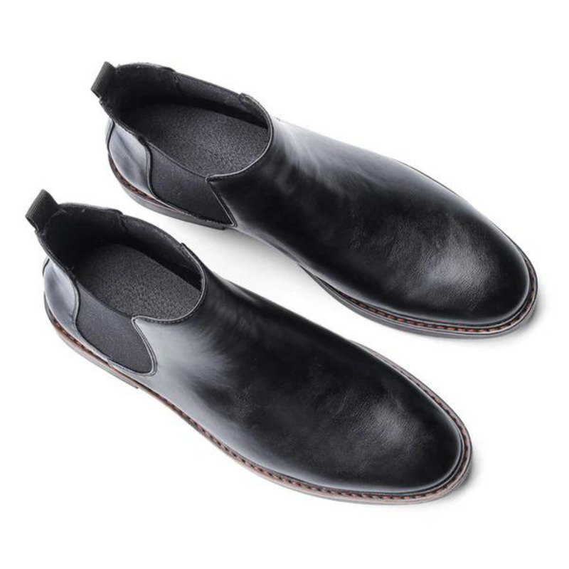 Schwarze Chelsea Boots aus Leder, elegante Herrenschuhe, rutschfeste Sohle, klassisches Design.