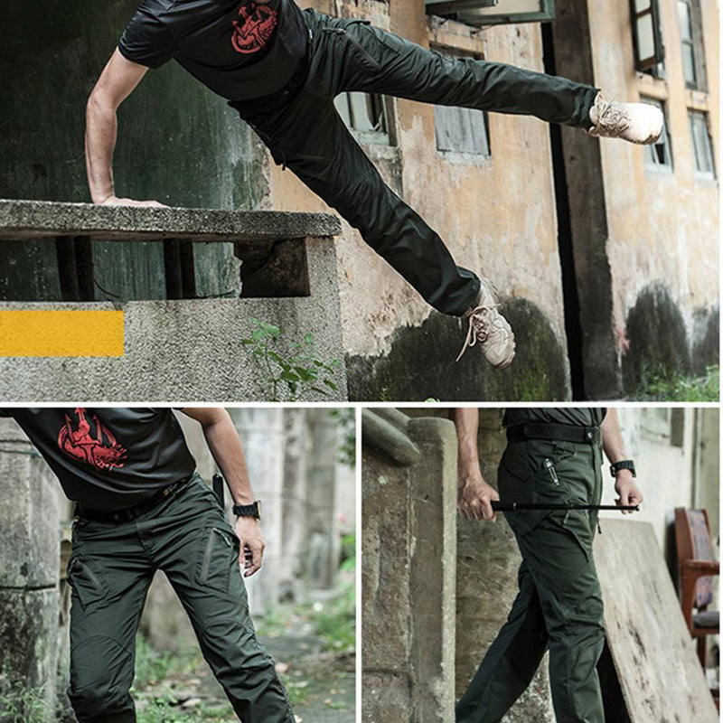 Mann in taktischer, olivgrüner Hose beim Parkour vor verlassenem Gebäude.