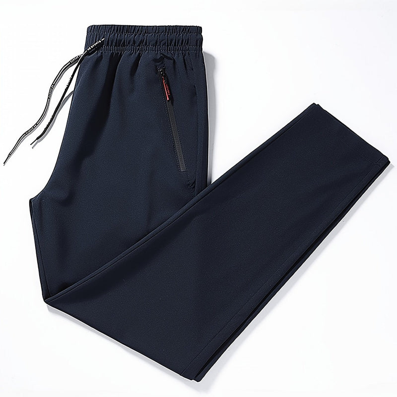 Dunkelblaue Jogginghose mit Kordelzug, Reißverschlusstasche, Sportbekleidung Herren.