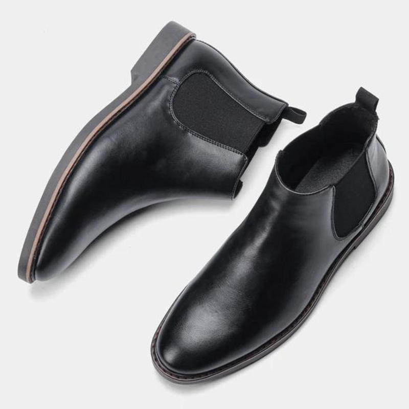Schwarze Chelsea Boots aus Leder, Herrenmode, elegante Schuhe, rutschfeste Sohle, stilvoll.