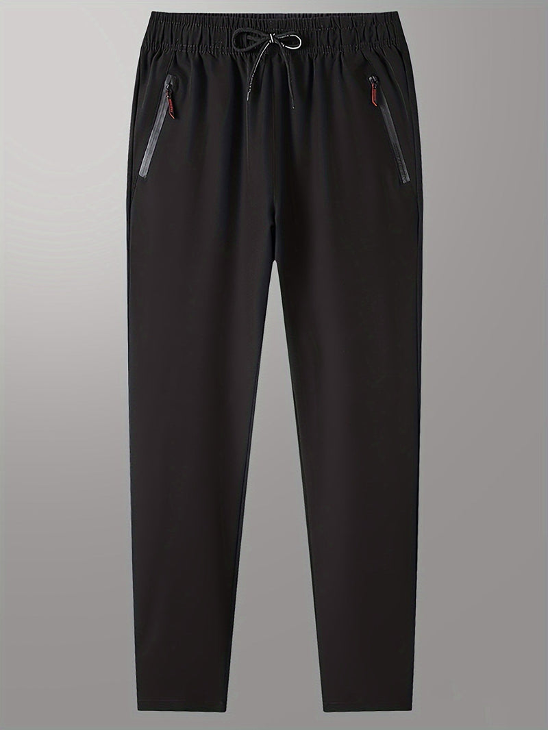 Schwarze Jogginghose mit Kordelzug, Reißverschlusstaschen, bequem, sportlich, Herrenmode.