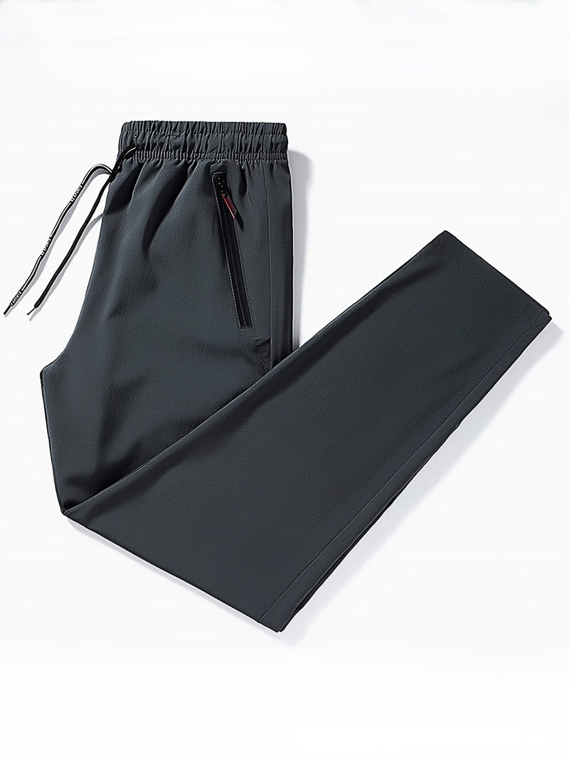 Schwarze Jogginghose, elastischer Bund, Reißverschlusstasche, Sportbekleidung, Herrenmode.