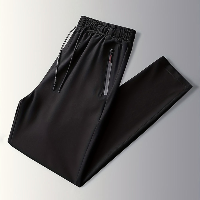 Schwarze Jogginghose mit Reißverschlusstaschen, elastischer Bund, Sportbekleidung Herren.