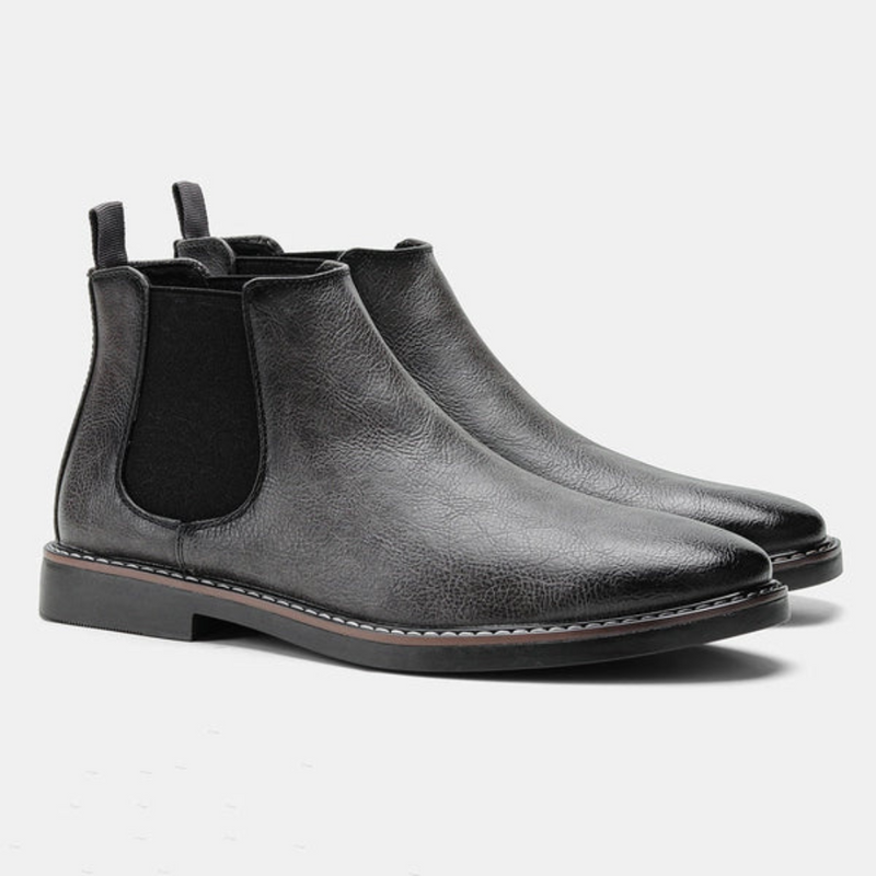 Schwarze Chelsea Boots aus Leder für Herren, elegant, rutschfeste Sohle, modisch.