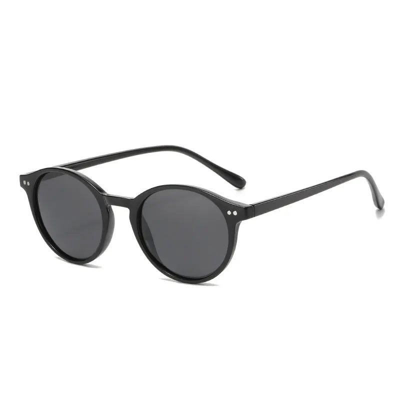 Schwarze runde Sonnenbrille, Unisex, UV-Schutz, modisches Accessoire, Kunststoffrahmen.