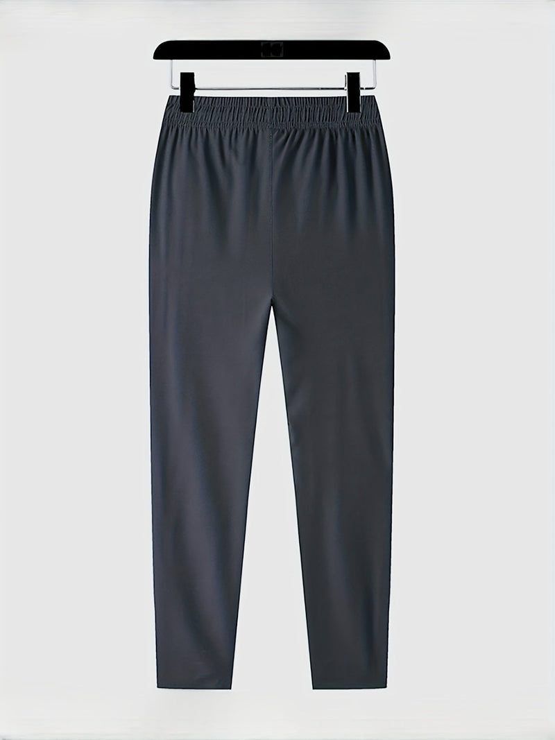 Dunkelgraue Jogginghose, elastischer Bund, bequem, Sportbekleidung, Herrenmode.