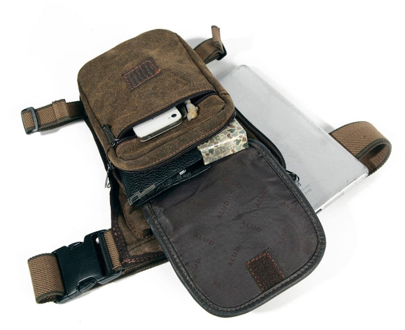 Braune Canvas-Umhängetasche mit mehreren Fächern, ideal für Reisen und Outdoor-Aktivitäten.
