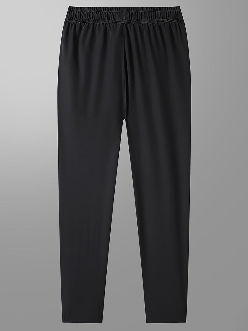 Schwarze Jogginghose, elastischer Bund, atmungsaktives Material, Sportbekleidung für Herren.
