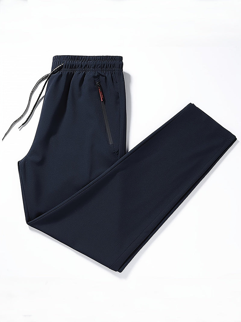 Dunkelblaue Herren-Jogginghose, elastischer Bund, Reißverschlusstasche, Sportbekleidung.