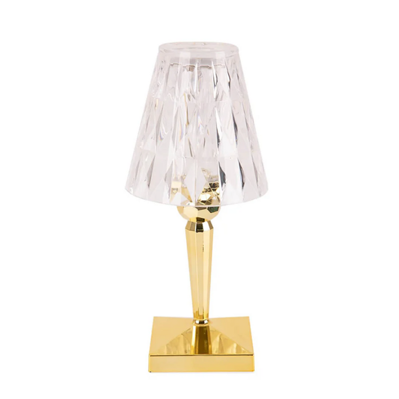 Goldene Tischlampe mit kristallklarem Schirm, modernes Design, elegante Wohnkultur.
