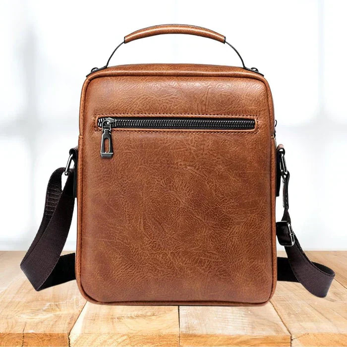 Braune Lederschultertasche mit Reißverschluss, modern und stilvoll, für Herren und Damen.