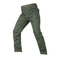 Grüne taktische Hose, Outdoor, robust, mit Reißverschlusstaschen, ideal für Wandern und Camping.