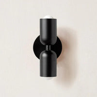Schwarze Wandleuchte, modernes Design, zylindrische Form, doppelseitig, Innenbeleuchtung.