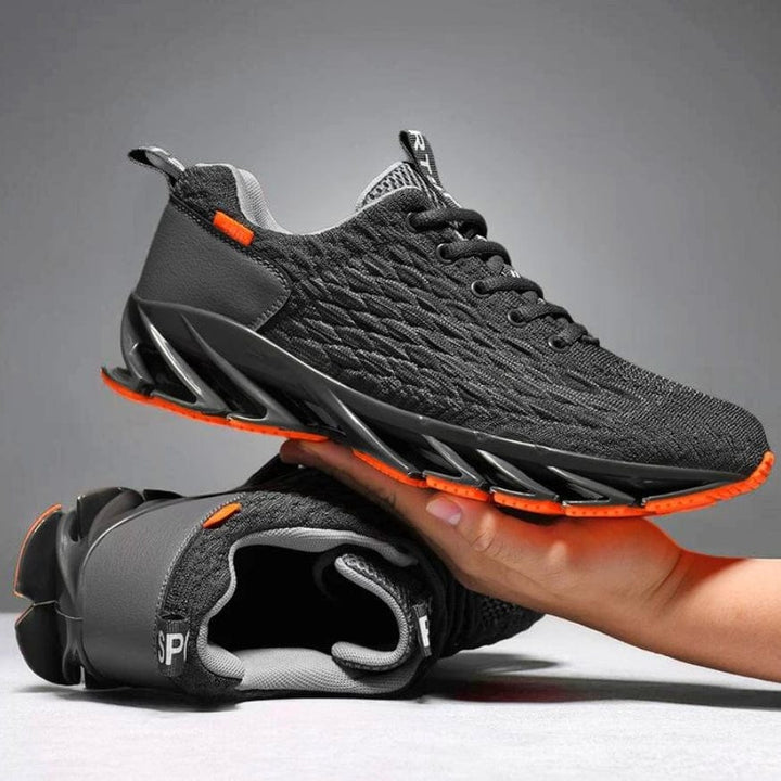 Schwarze Sportschuhe mit orangen Akzenten, atmungsaktives Mesh, rutschfeste Sohle, Herren Sneaker.