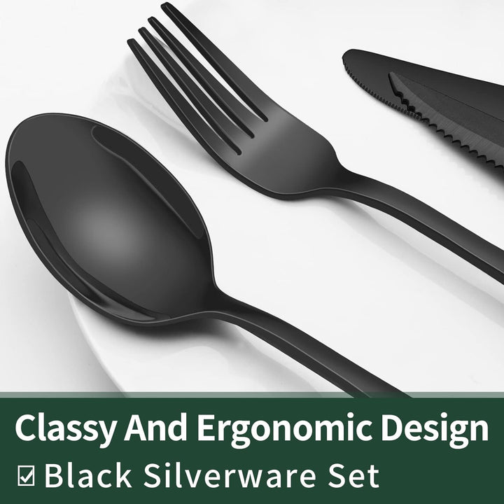 Schwarzes Besteckset aus Edelstahl, ergonomisches Design, Löffel, Gabel, Messer auf Teller.