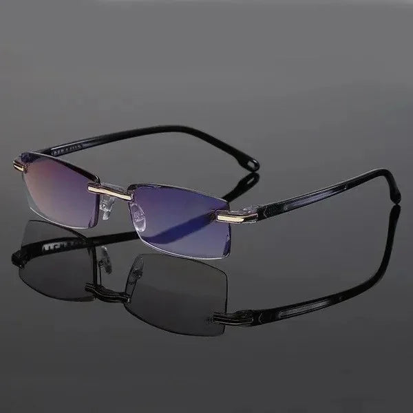 Schwarze randlose Sonnenbrille mit lila Gläsern auf grauem Hintergrund.