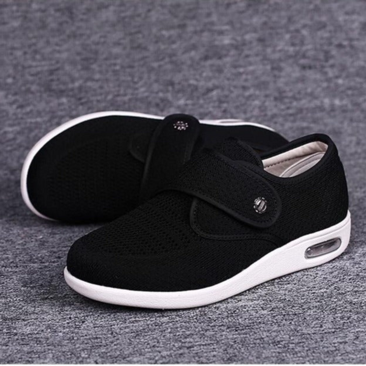 Schwarzer Sneaker mit Klettverschluss, atmungsaktiv, rutschfest, für Damen und Herren.