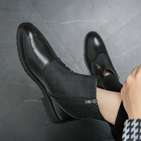 Schwarze Herrenstiefel aus Leder mit Reißverschluss, elegantes Design, rutschfeste Sohle.