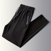 Schwarze Jogginghose mit Reißverschlusstaschen, elastischer Bund, Sportbekleidung Herren.
