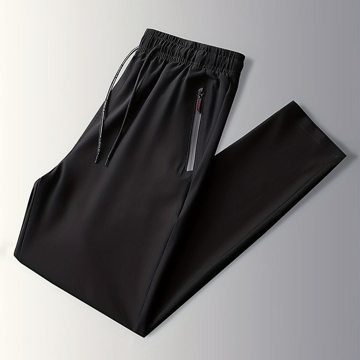 Schwarze Jogginghose mit Reißverschlusstaschen, elastischer Bund, Sportbekleidung Herren.