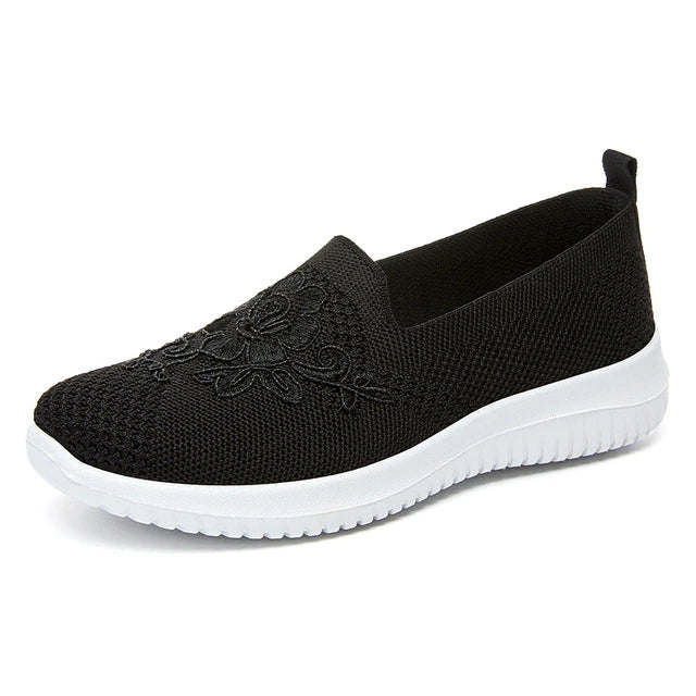 Schwarzer Damen-Sneaker aus Mesh mit Blumenmuster, atmungsaktiv, rutschfeste Sohle.
