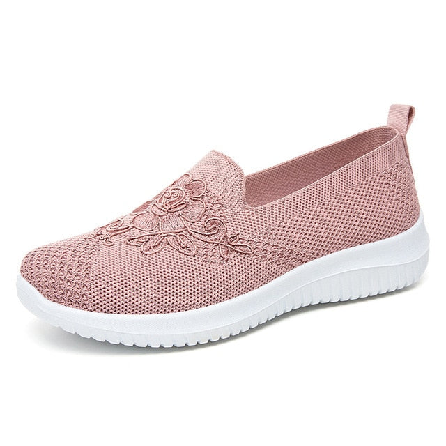 Rosa Damen-Sneaker aus Mesh mit Blumenstickerei, atmungsaktiv und bequem.