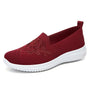 Rote Damen-Sneaker aus Mesh mit Blumenstickerei, bequem und atmungsaktiv.