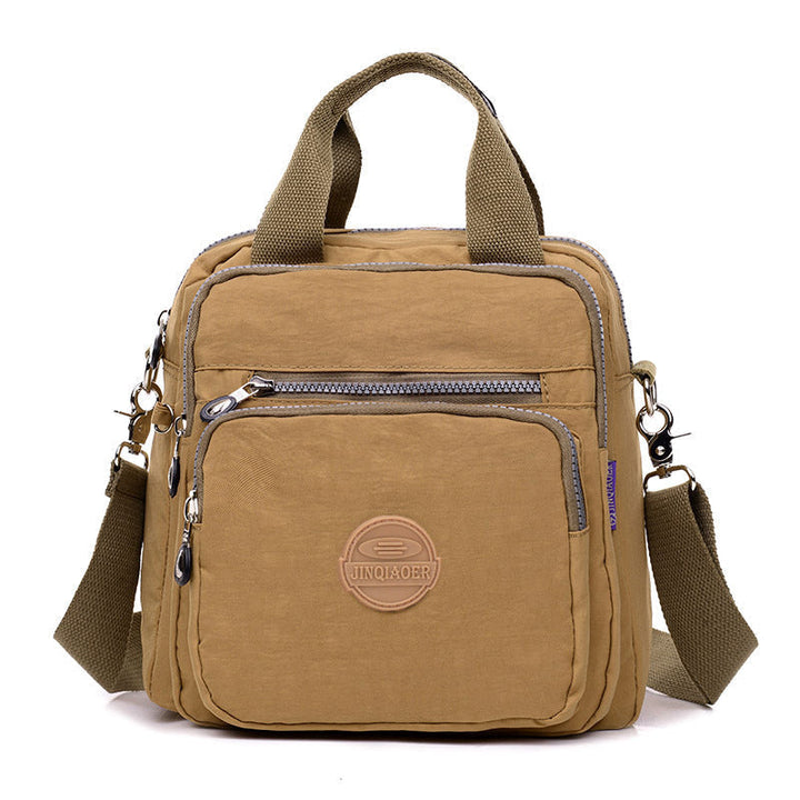 Beige multifunktionale Umhängetasche, Nylon, Reißverschlüsse, verstellbarer Gurt, lässiges Design.