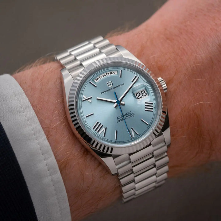 Silberne Automatikuhr mit blauem Zifferblatt, Edelstahlarmband, Datumsanzeige, Herrenuhr.