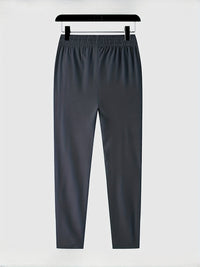 Dunkelgraue Jogginghose, elastischer Bund, bequem, Sportbekleidung, Herrenmode.