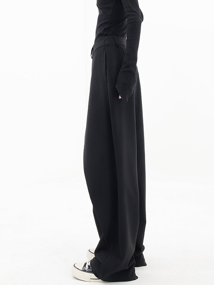 Schwarze asymmetrische Baggy-Hose für Damen, lässig, modisch, bequem, aus Baumwolle.