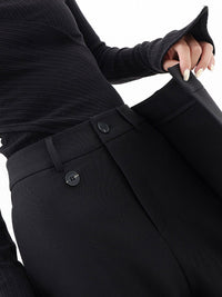 Schwarze asymmetrische Baggy-Hose, Damenmode, elastischer Bund, Knopfverschluss.