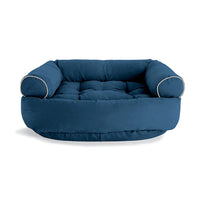 Blaues Hundebett aus Stoff mit erhöhten Seiten, bequemes Design, ideal für mittelgroße Hunde.