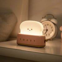 Nachtlicht in Toastform, LED, warmweiß, Kinderzimmer, dekorativ, USB-aufladbar, rosa.
