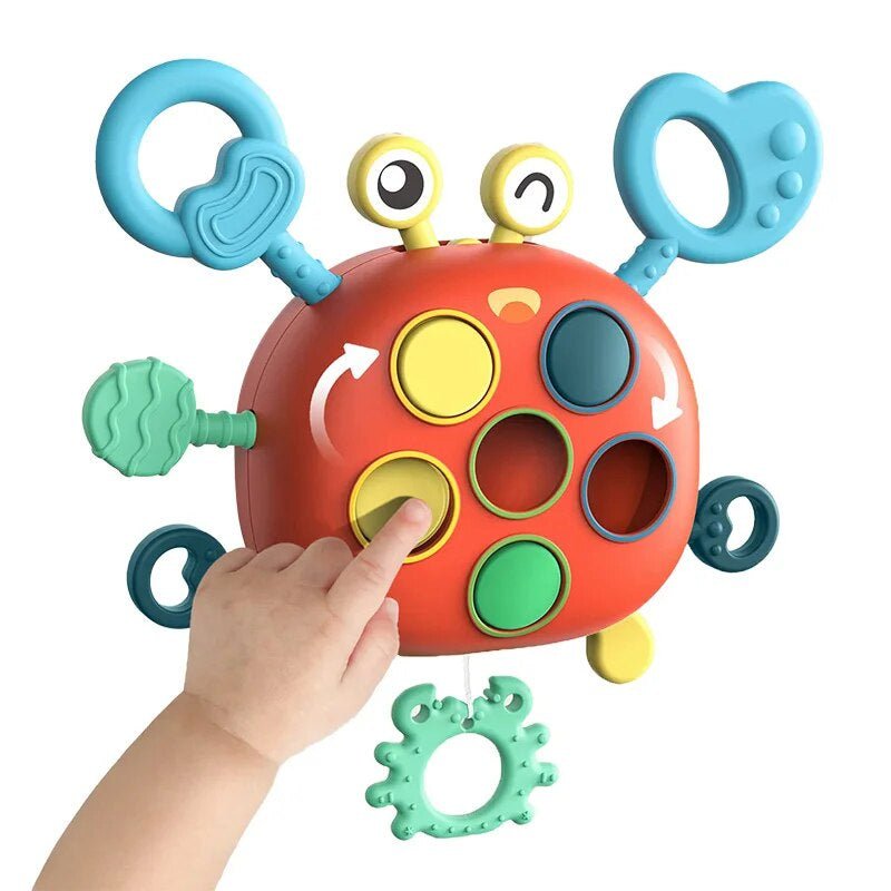 Buntes sensorisches Krabben-Spielzeug für Babys, motorische Entwicklung, Kunststoff, Hand.