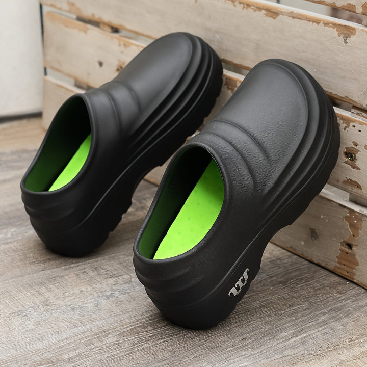 Schwarze Clogs mit grüner Innensohle, rutschfest, Unisex, bequem, für Gartenarbeit.