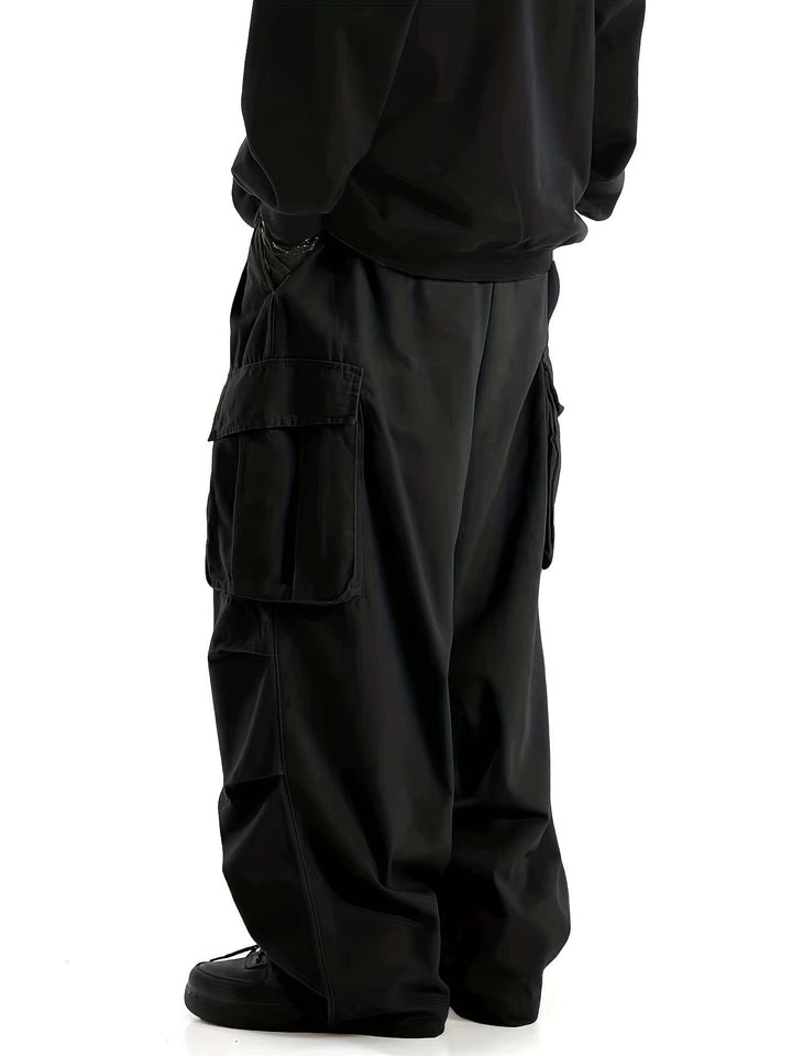 Schwarze Cargo-Hose Herren, weites Bein, Taschen, Streetwear, modisch, lässig, Baumwolle.