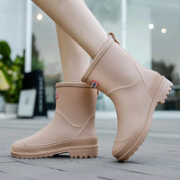 Beige Gummistiefel für Damen, wasserdicht, rutschfest, ideal für Regenwetter.
