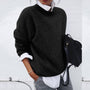 Damenpullover schwarz, lässig, Strick, Herbstmode, übergroß, eleganter Stil, Freizeitkleidung.