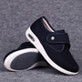 Schwarze Damen-Sneaker mit Klettverschluss, atmungsaktiv, rutschfeste Sohle, bequem.