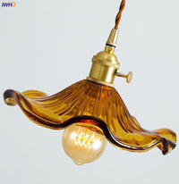 Vintage Pendelleuchte aus Glas, bernsteinfarben, mit Edison-Glühbirne, Retro-Design.