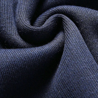 Dunkelblauer Baumwollstoff, Nahaufnahme, weiche Textur, hochwertige Strickware, Detailansicht.