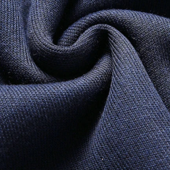 Dunkelblauer Baumwollstoff, Nahaufnahme, weiche Textur, hochwertige Strickware, Detailansicht.
