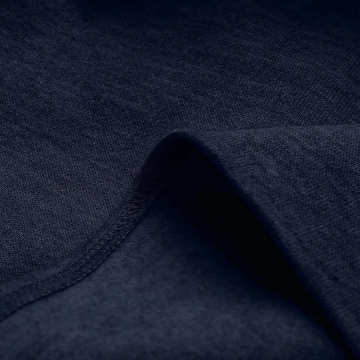 Dunkelblauer Baumwollstoff, Nahaufnahme, weiche Textur, ideal für Bekleidung und Heimtextilien.