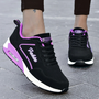 Schwarze Damen-Sneaker, lila Akzente, wasserdicht, leicht, Straßenschuhe.
