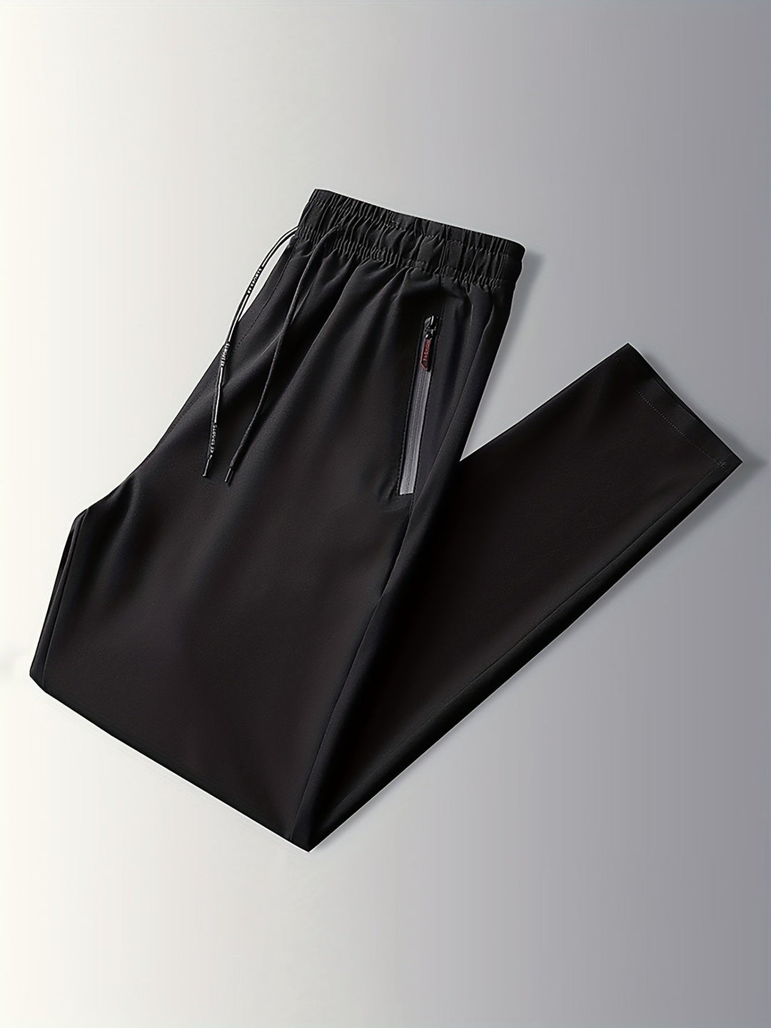 Schwarze Jogginghose mit Reißverschlusstaschen, elastischem Bund, Sportbekleidung Herren.