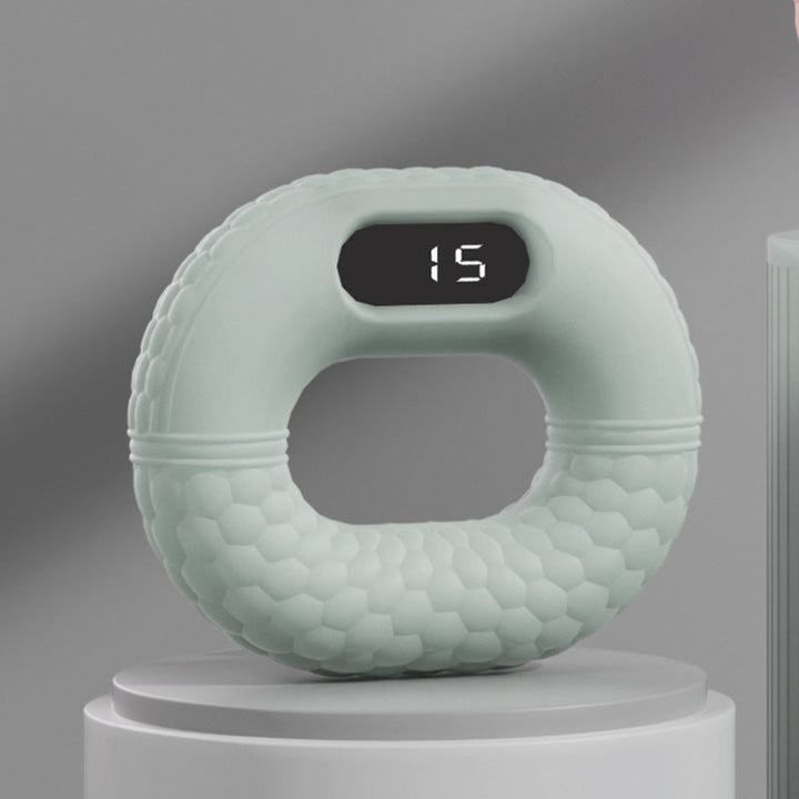 Grüner digitaler Fitnessring mit Display, ergonomisches Design, Heimtraining, Sportgerät.