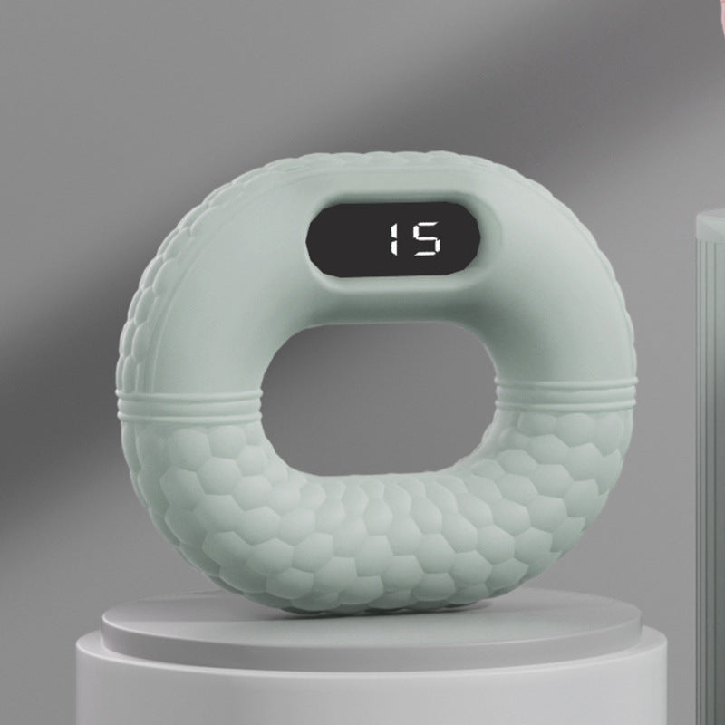Grüner digitaler Fitnessring mit Display, ergonomisches Design, Heimtraining, Sportgerät.