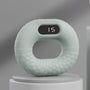 Grüner digitaler Fitnessring mit Display, ergonomisches Design, Heimtraining, Sportgerät.